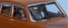 SAI 1631 - Peugeot 504 brun orangé, avec conducteur et 1 passager